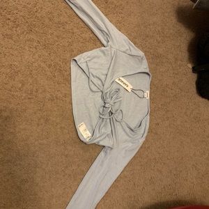 blue garage cropped top with tie in front